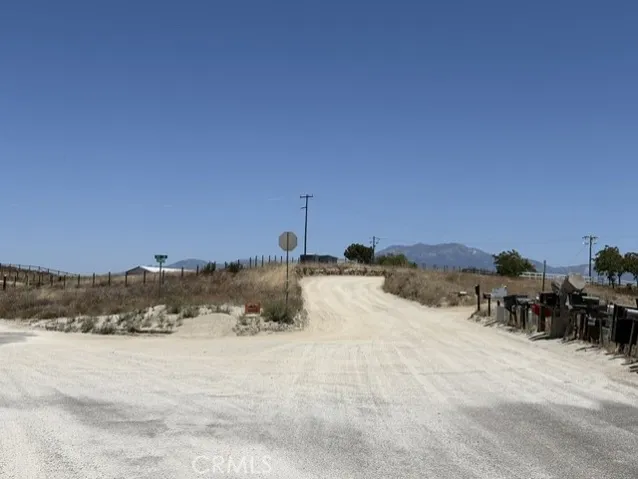 Dirt road to Right at fork by mailboxes.