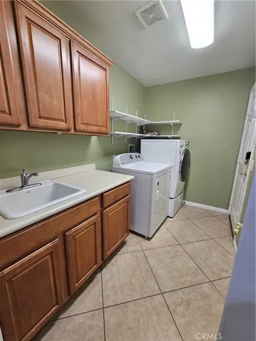 Laundry room off Kitchen area leading into the garage