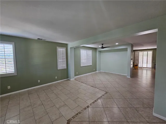 Living room area opens to family room and kitchen