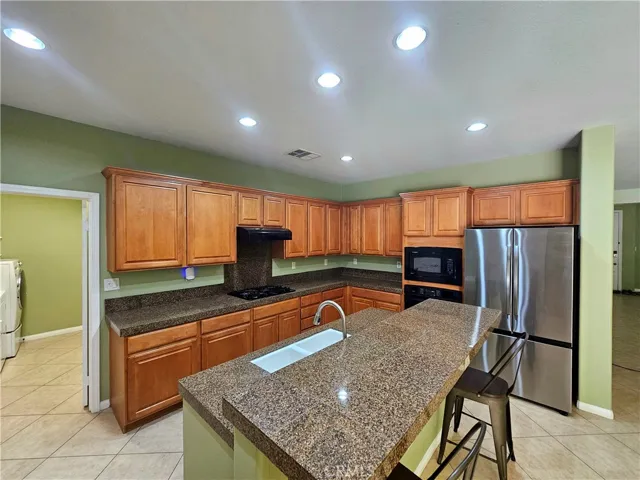 Lots of kitchen cabinets and storage in this large family kitchen