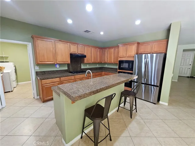 Kitchen leads to the laundry room that has access to the garage