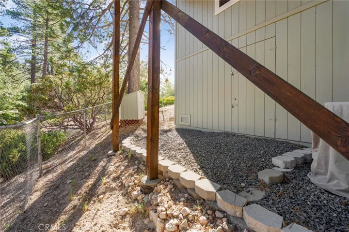 Fenced area with access to workshop storage area.