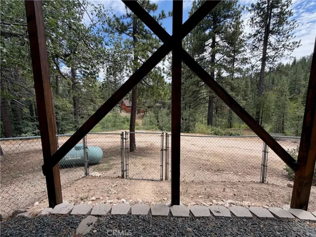Fenced yard with back access for additional parking.