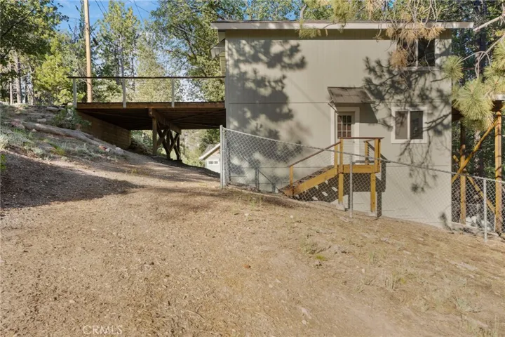 Side view showing access to fenced back yard.