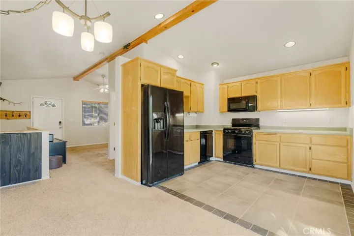 Main level living room, bathroom, laundry, dining and kitchen.