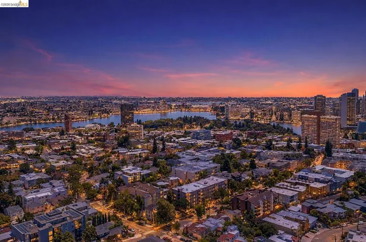 Expansive city and water scenery featuring a body of water surrounded by urban development