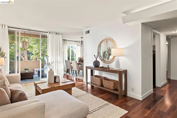 Hardwood-finish flooring throughout, complemented by a private outdoor patio with sliding glass doors