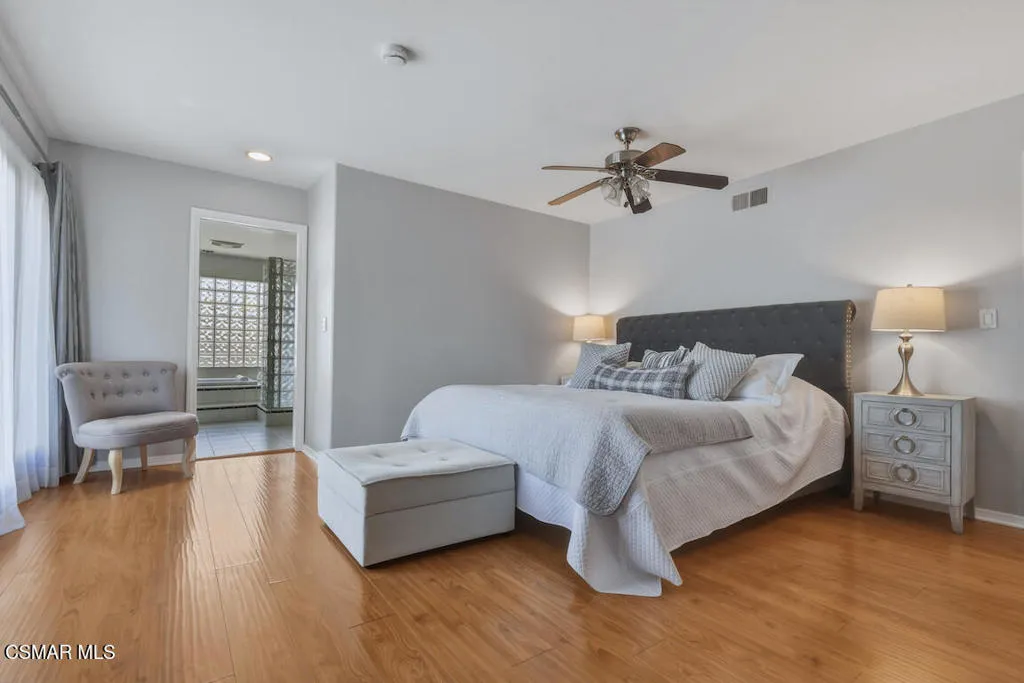 Primary bedroom with balcony