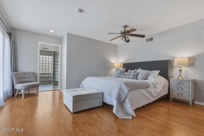 Primary bedroom with balcony