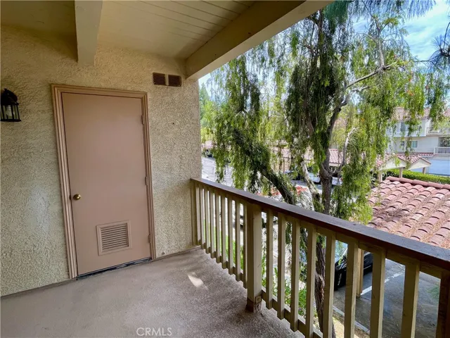 Laundry room in covered balcony area