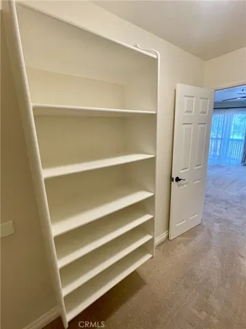 Bedroom walk in closet shelving