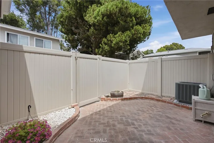 Patio w/ tall vinyl fence