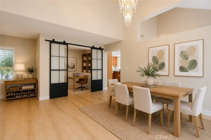Virtual staging showing flex space as office and potential for dining room opposite.