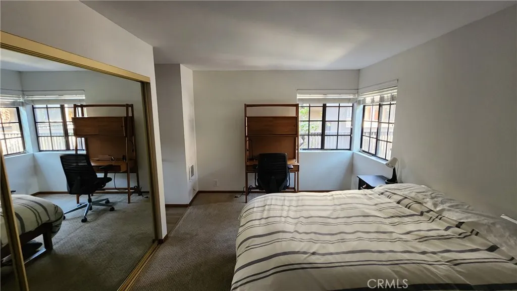Bedroom features corner windows