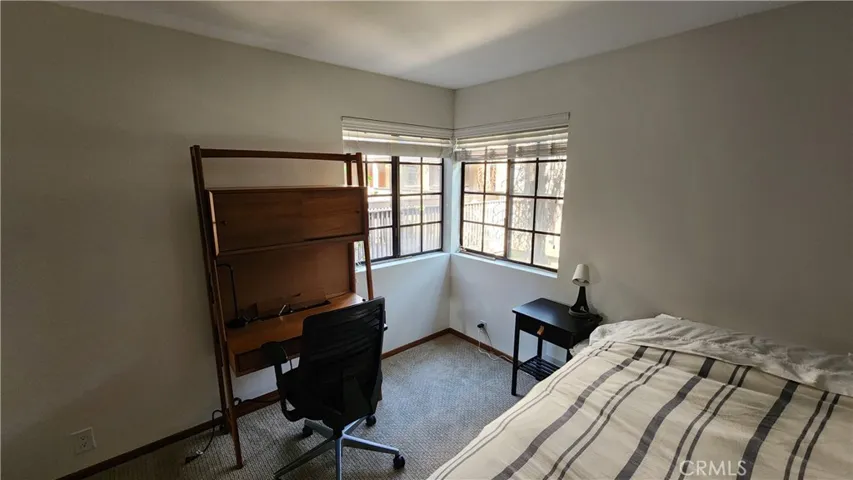 Bedroom with room for desk and chair