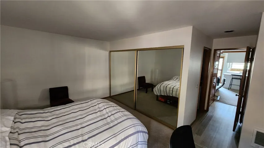 Bedroom features luxury vinyl plank flooring.