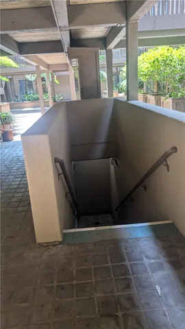 Stairs down to garage from near mailbox area