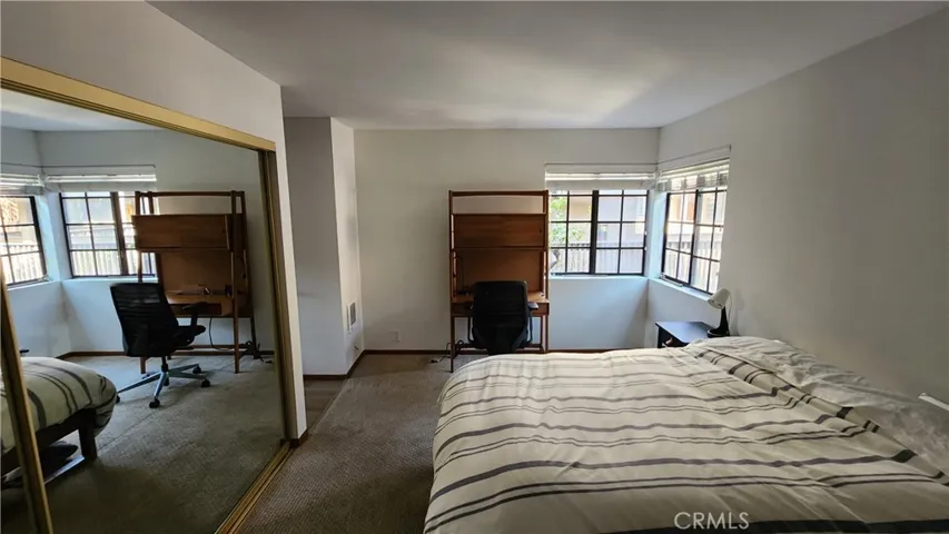 Bedroom features corner windows