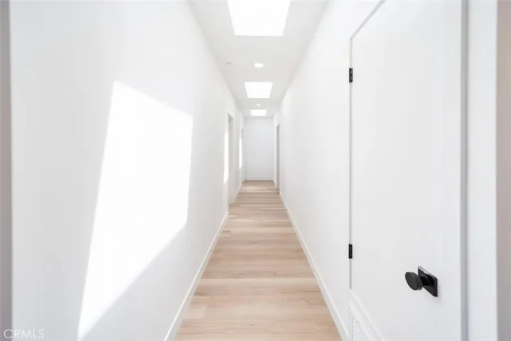 Hallway with 3 remote controlled skylights