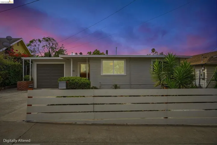 Exterior featuring horizontal siding and a covered entry