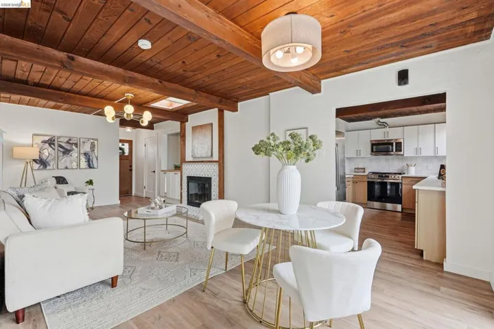 Exposed wood beam ceiling throughout this open-concept living​​‌​​​​‌​​‌‌​​‌​​​‌‌​​​‌​​‌‌​​‌‌​​‌‌​​​​ space