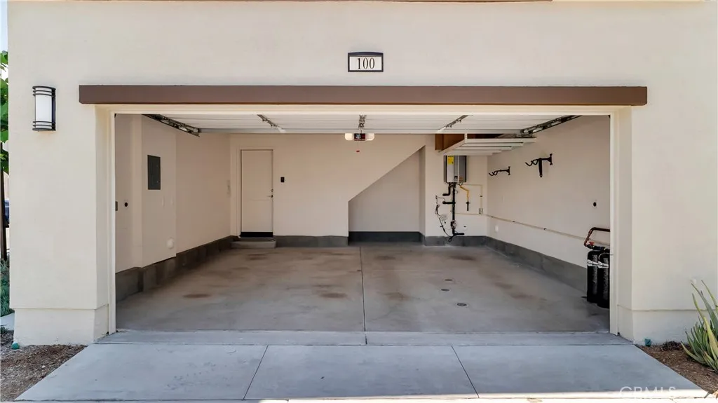 2 Car Garage - With Two (2) EV Chargers and Overhead Storage