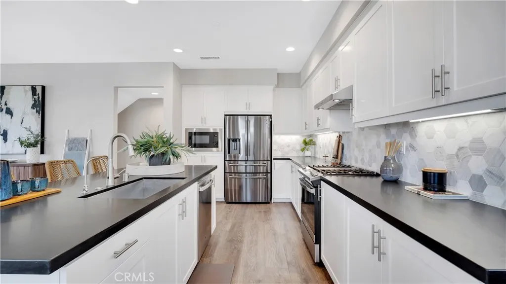 Kitchen - Matte Granite Counter with Hexagon Tile Backsplash