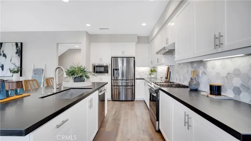 Kitchen - Matte Granite Counter with Hexagon Tile Backsplash