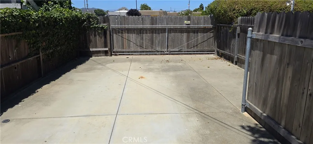 16' sliding gate with alley access behind.