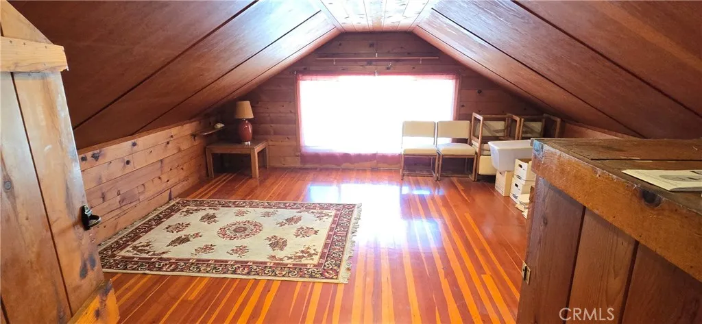 Beautiful wood floors & wood lined walls & ceiling