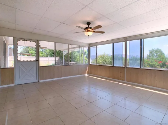 Enclosed sun room adds to the living space bringing the outdoors in.