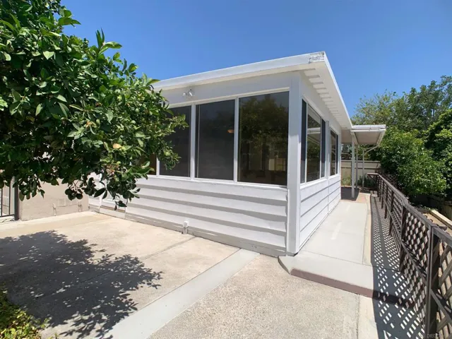 Exterior back offers a fruit tree as well.