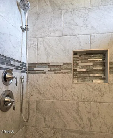 REMODELED SHOWER WITH TILE DETAILS