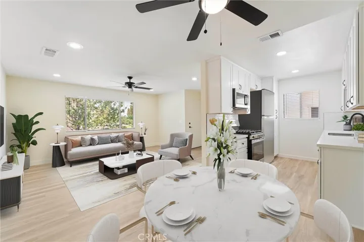 Living room/dining room area virtually staged