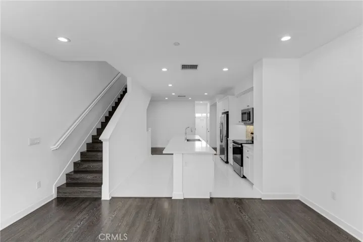 Family Room/Living Room to Kitchen stairs  to 3rd Level