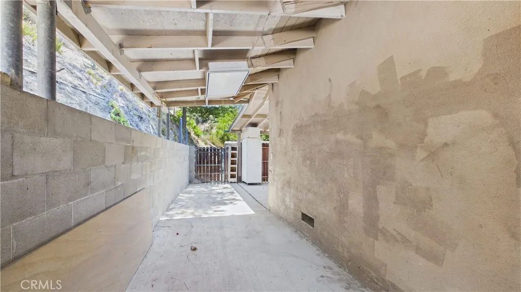 Behind garage