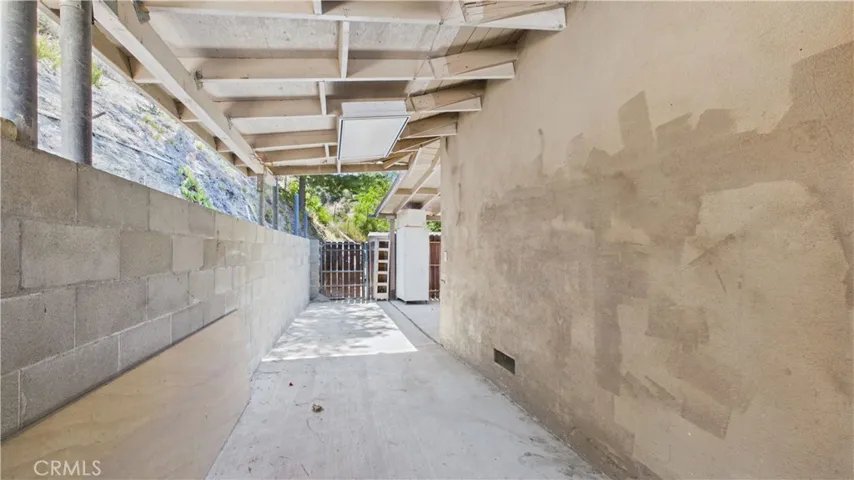 Behind garage