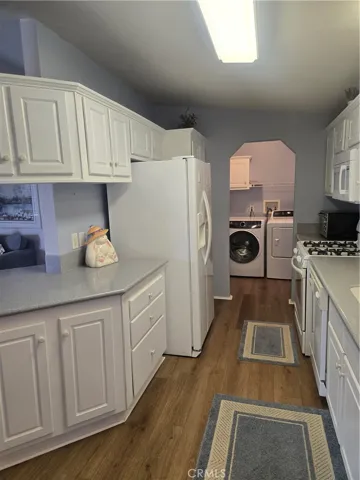 more of kitchen with laundry