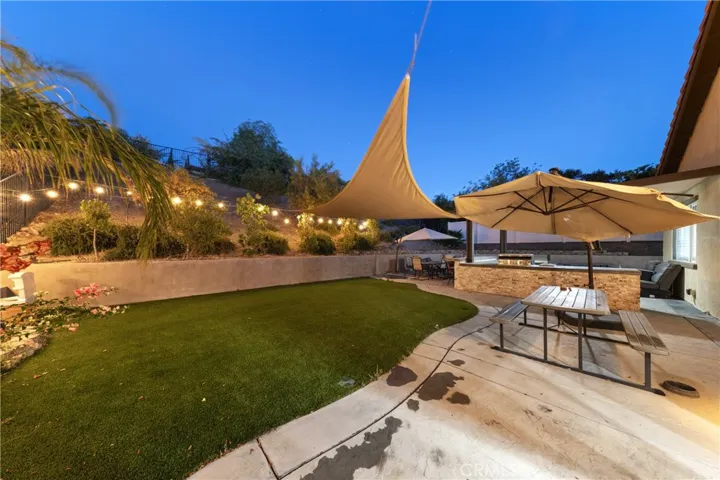 Backyard turf and BBQ island