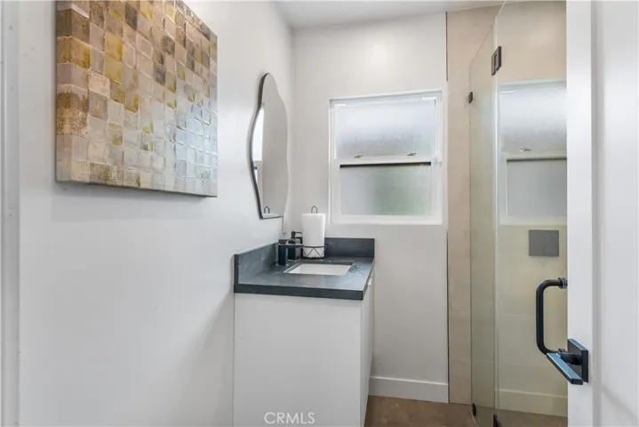 Second updated bathroom with shower in main house.