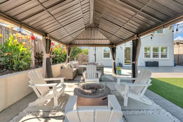 Covered Fire pit seating area and Dining Area