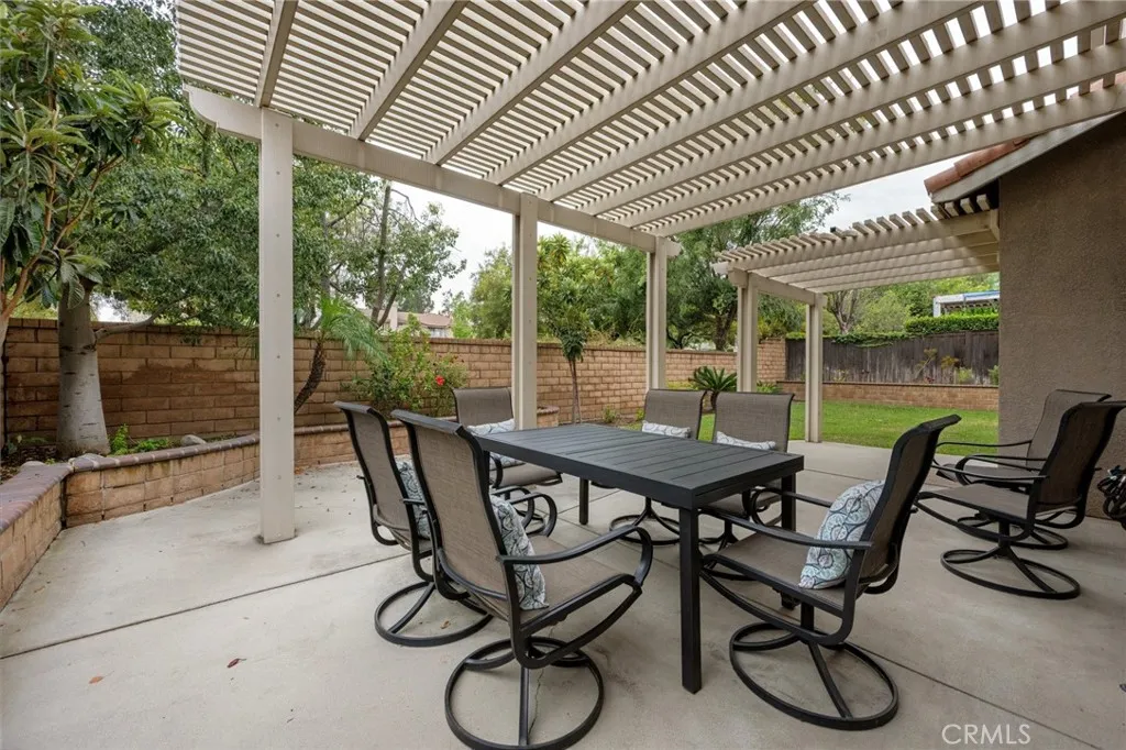 Aluminum pergoloa serves as an outdoor  dining area, perfect for outdoor entertaining.