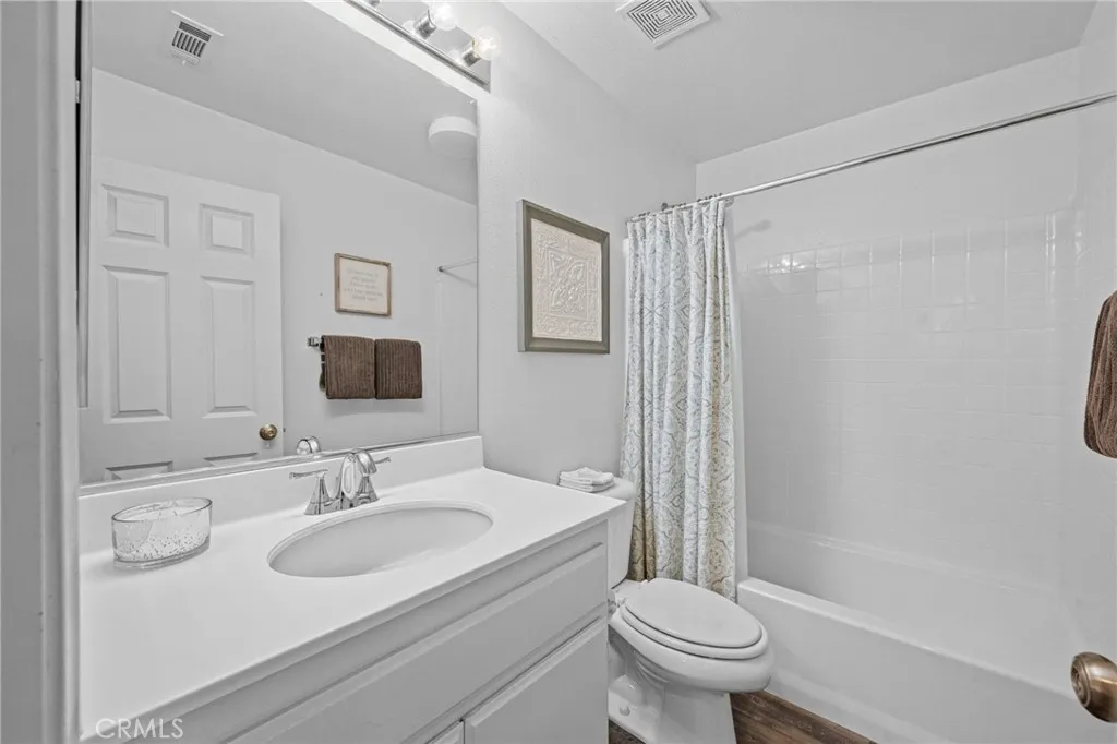 Full downstairs bathroom with tub/shower combo and tasteful finishes.