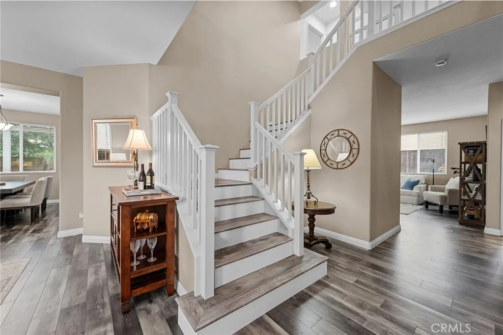 Elegant staircase with wood tread accents.