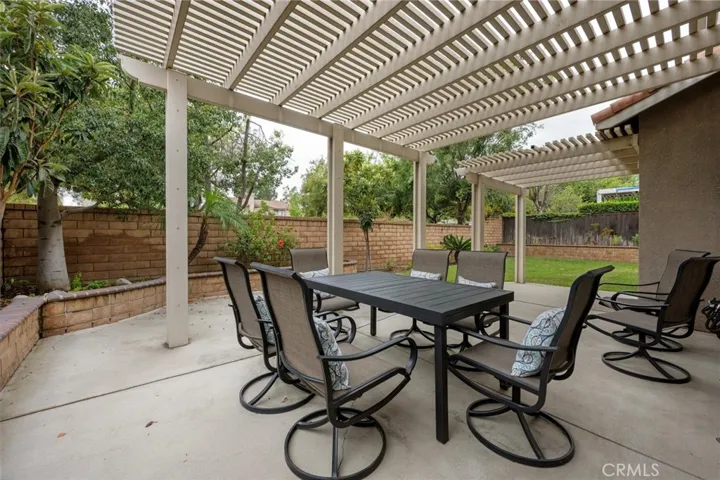 Aluminum pergoloa serves as an outdoor  dining area, perfect for outdoor entertaining.