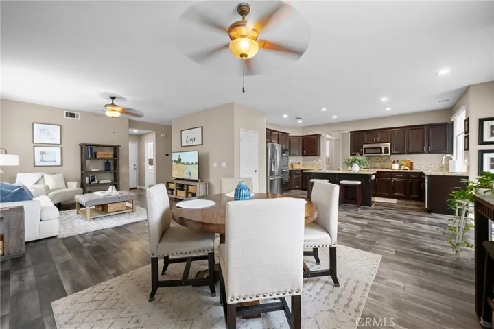 The connected living space offers a natural extension for relaxing or hosting, making this the true heart of the home.