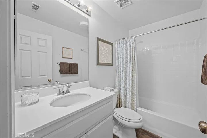 Full downstairs bathroom with tub/shower combo and tasteful finishes.