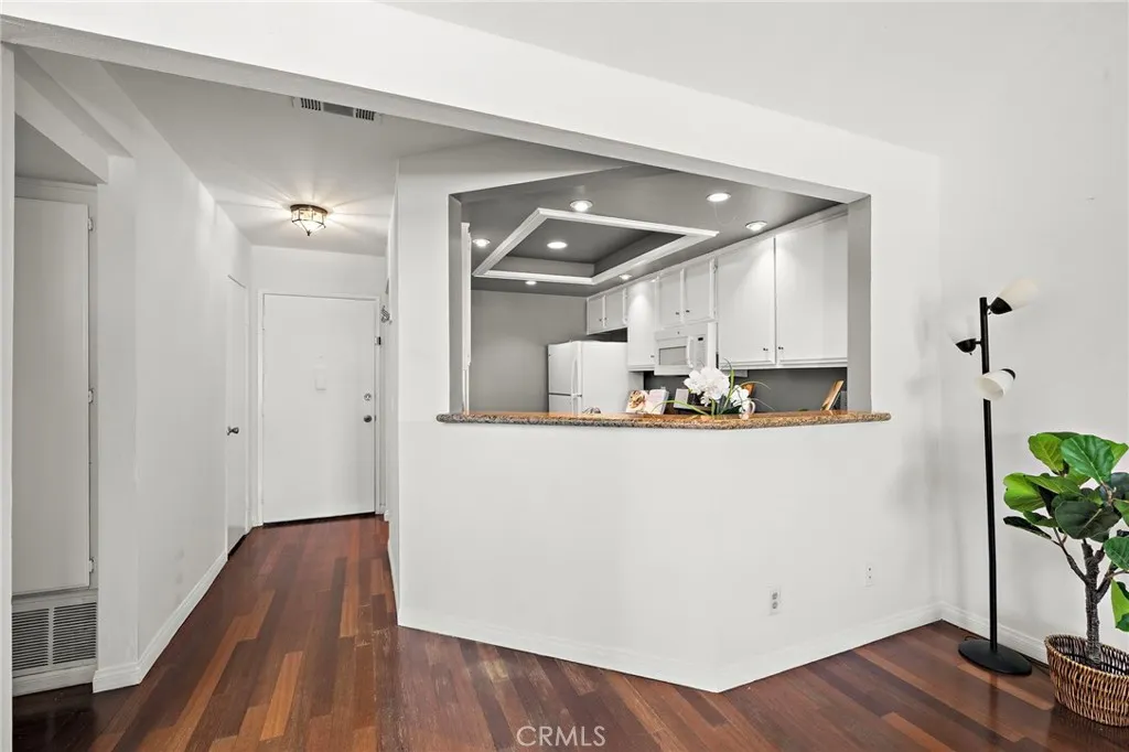 view of the front door and kitchen