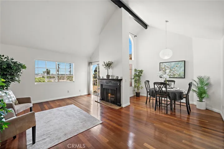 Living room view with fire place  and dining area