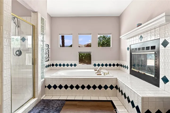 Primary Bathroom w/ See Thru Facing Fireplace & Soaking Tub
